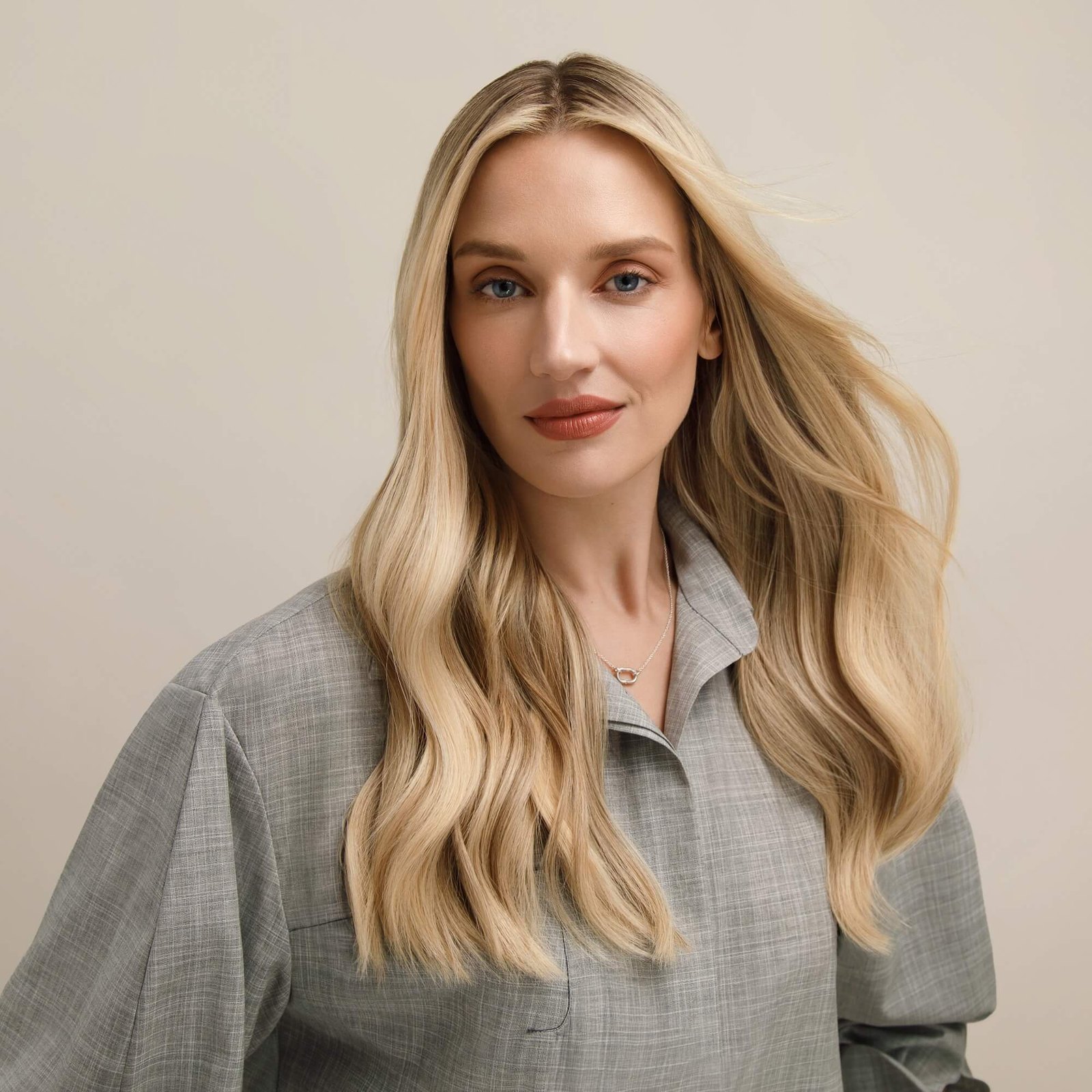 Soft blonde waves with seamless added length from extensions at Spoke & Weal